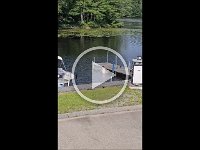 nicholasjumpinginlakewithgrass2015